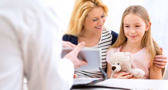 View of a Little girl at the doctor with her mother